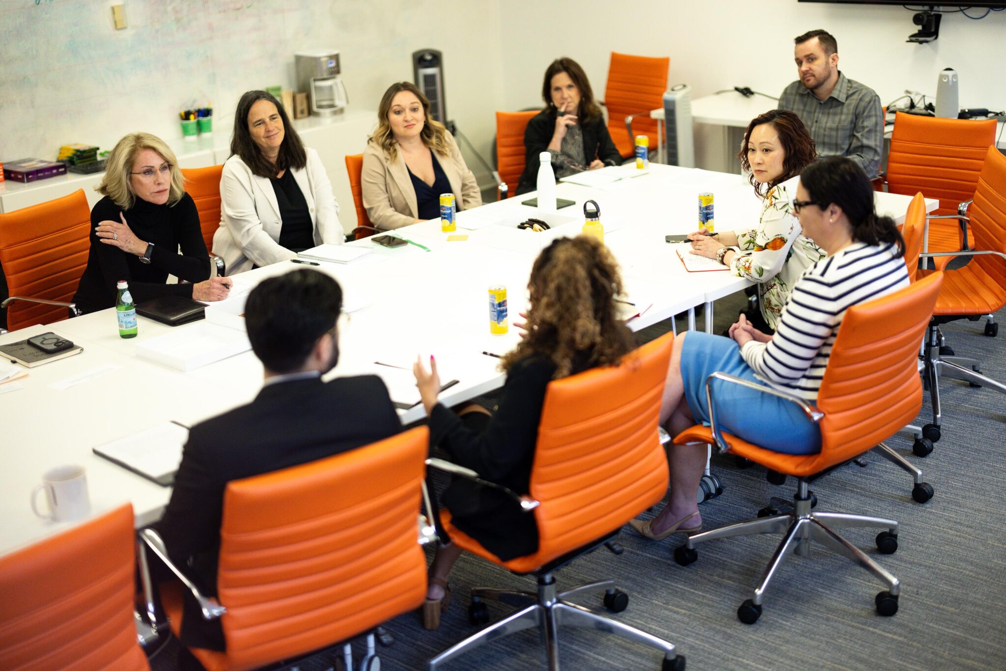 Sheri Schultz and the team in a modern conference room